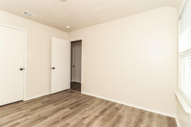 unfurnished bedroom with light hardwood / wood-style floors