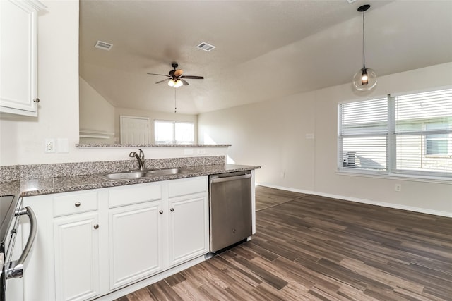 kitchen featuring dark wood-type flooring, sink, white cabinetry, hanging light fixtures, and stainless steel appliances