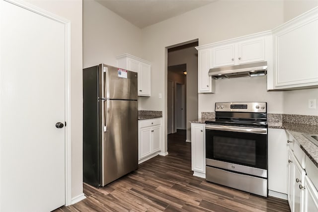 kitchen with white cabinetry, appliances with stainless steel finishes, dark hardwood / wood-style flooring, and dark stone countertops