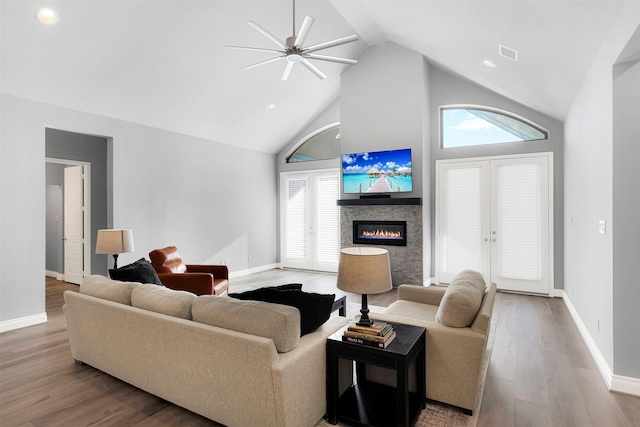 living room featuring french doors, hardwood / wood-style floors, ceiling fan, and a wealth of natural light