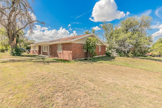 view of property exterior with a lawn