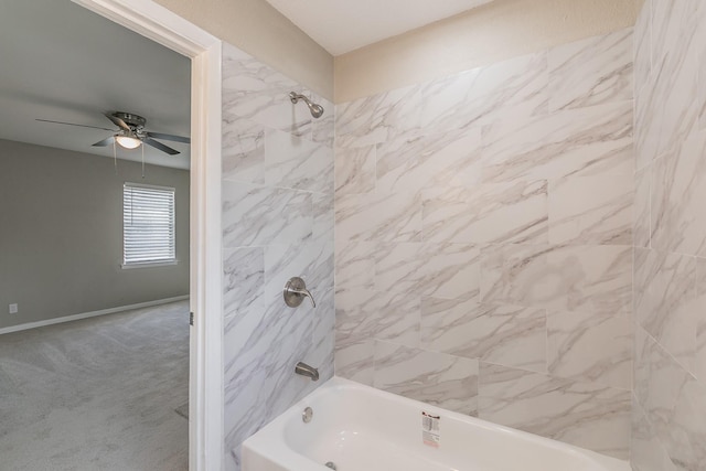 bathroom with ceiling fan and tiled shower / bath