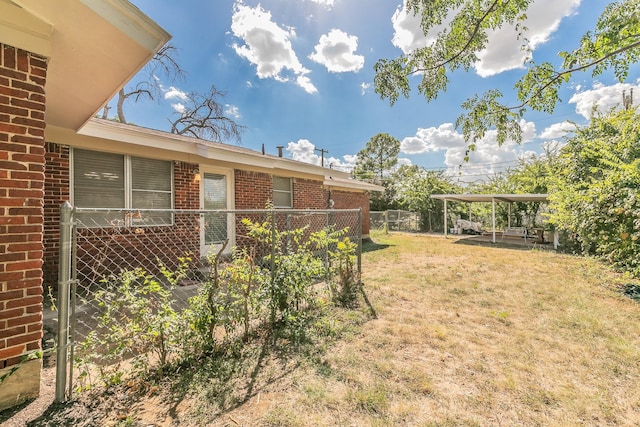 view of yard featuring a carport