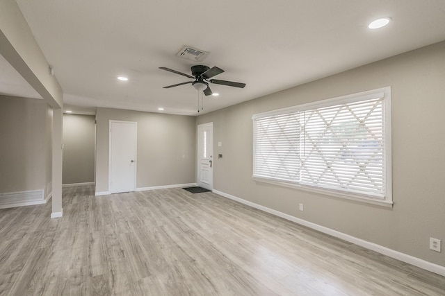 spare room featuring ceiling fan and light hardwood / wood-style floors