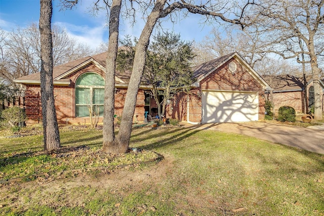 view of front of property featuring a front yard and a garage