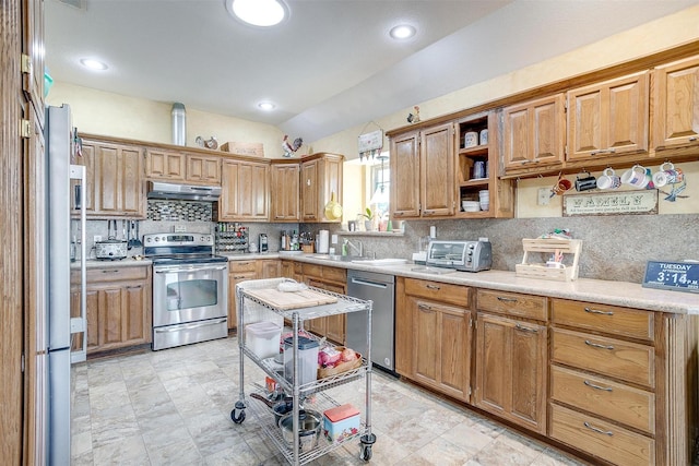 kitchen featuring decorative backsplash, sink, and stainless steel appliances