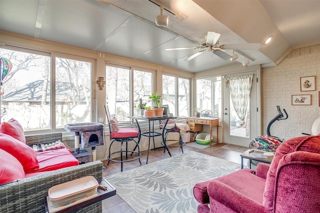 sunroom with vaulted ceiling and ceiling fan