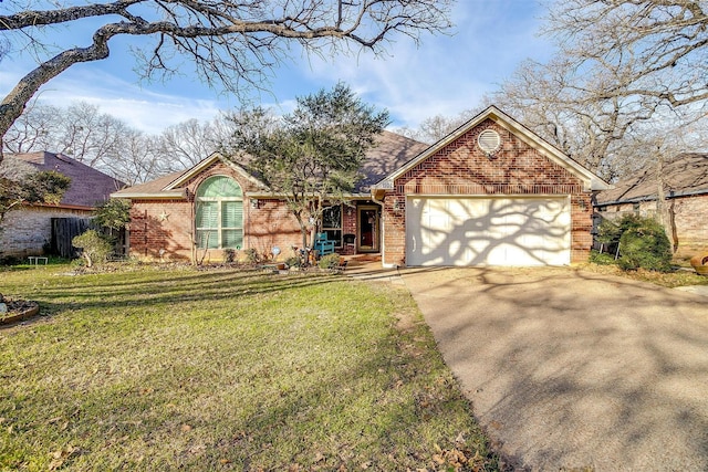 view of front of property featuring a front lawn and a garage