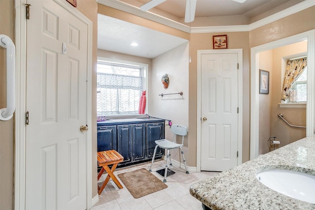 bathroom with tile patterned flooring and vanity