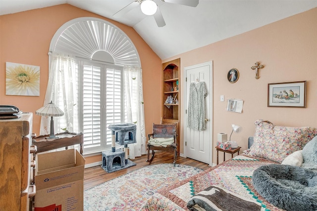 bedroom with multiple windows, ceiling fan, and lofted ceiling