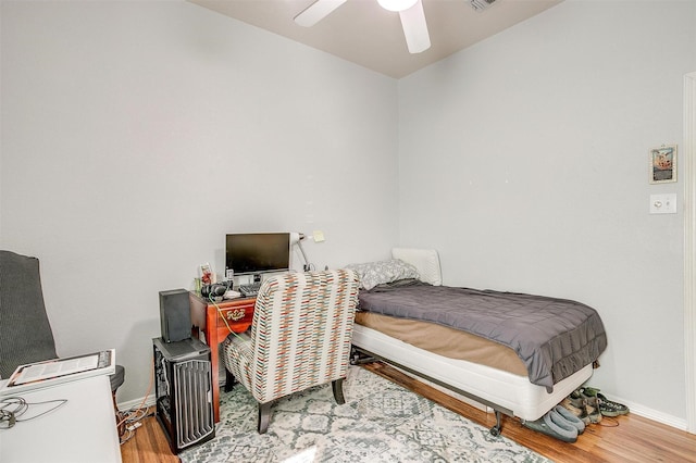 bedroom featuring ceiling fan and wood-type flooring