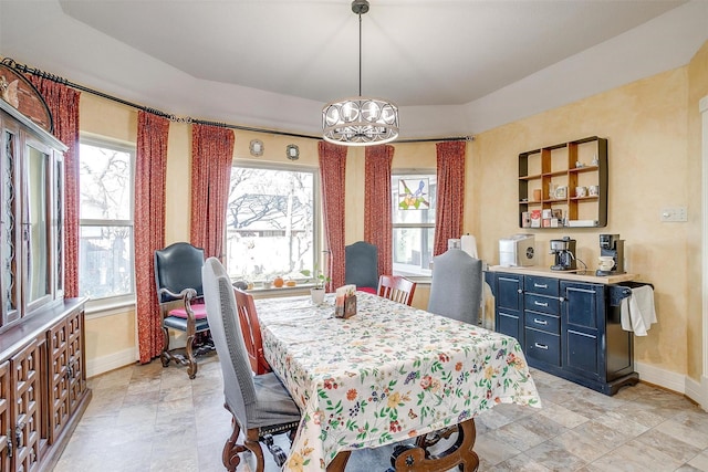 dining room featuring a notable chandelier and plenty of natural light