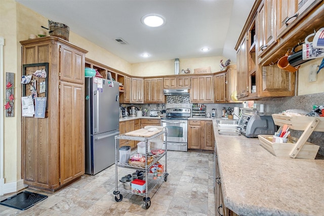 kitchen featuring tasteful backsplash, sink, and stainless steel appliances