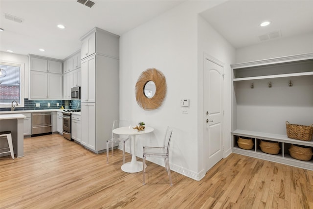 interior space featuring light wood-type flooring and sink