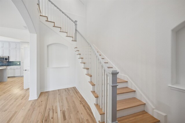 staircase featuring hardwood / wood-style floors