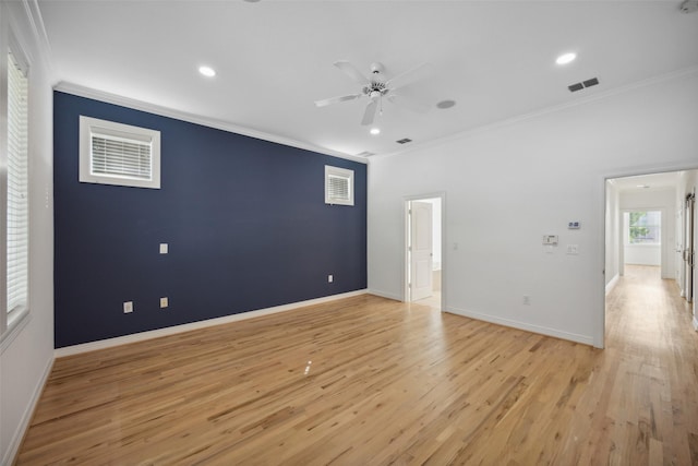 unfurnished room featuring light wood-type flooring, ceiling fan, and crown molding