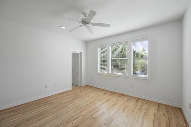 unfurnished room with light hardwood / wood-style floors and ceiling fan