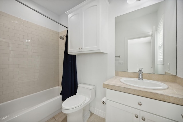 full bathroom featuring tile patterned floors, vanity, toilet, and shower / bath combo with shower curtain