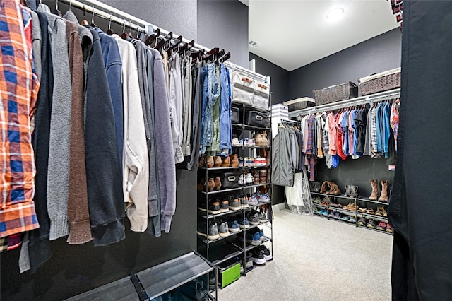 walk in closet featuring carpet