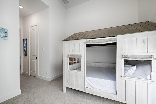 unfurnished bedroom with a closet and light carpet