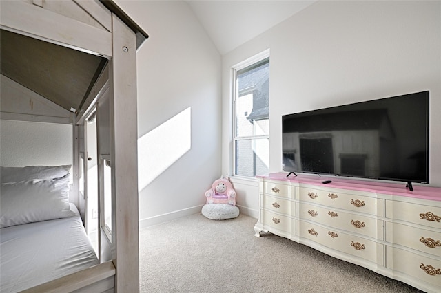 carpeted bedroom with vaulted ceiling