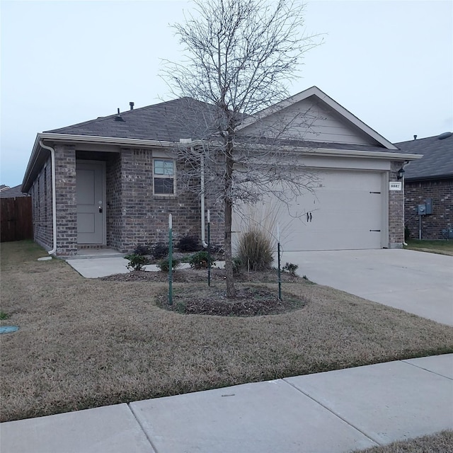 ranch-style home featuring a garage