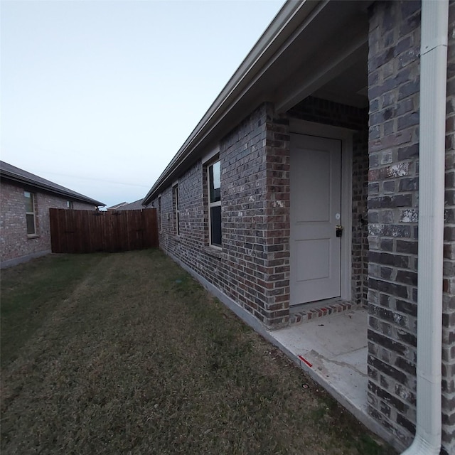 view of home's exterior featuring a yard