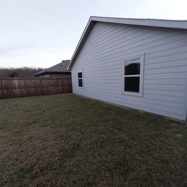 view of property exterior featuring a yard