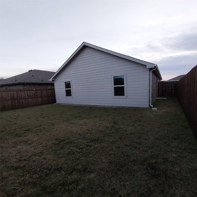 view of property exterior with a yard