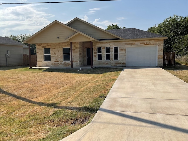 view of front of house with a garage and a front yard