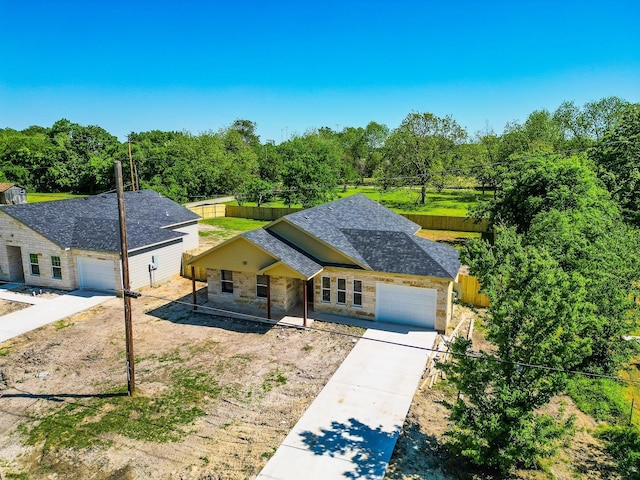 view of front of house featuring covered porch and a garage