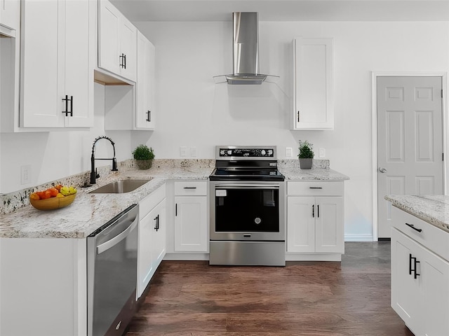 kitchen with white cabinets, sink, wall chimney range hood, and stainless steel appliances