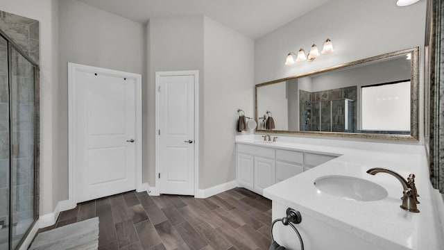 bathroom featuring vanity and an enclosed shower