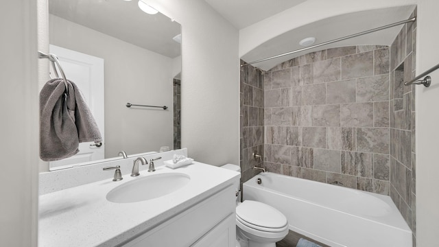 full bathroom with vanity, toilet, and tiled shower / bath