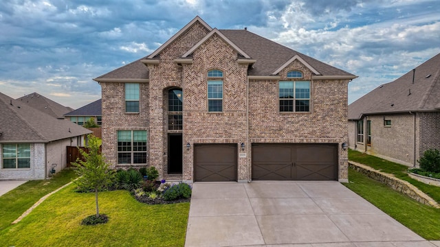 view of front facade featuring a front lawn and a garage