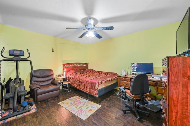 bedroom with dark hardwood / wood-style flooring and ceiling fan