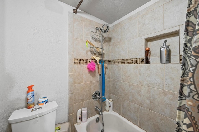 bathroom featuring shower / bath combo, a textured ceiling, and toilet