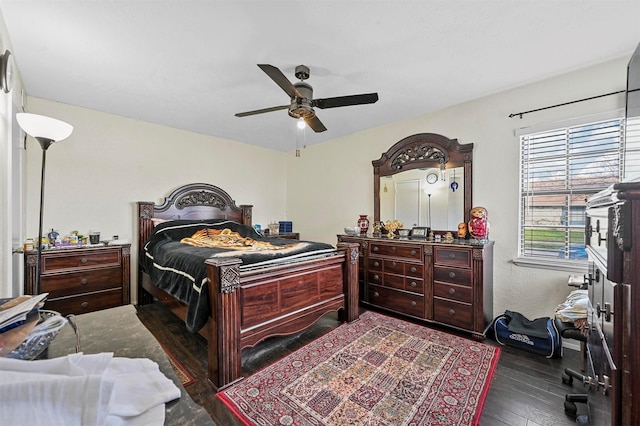 bedroom featuring ceiling fan and dark wood-type flooring