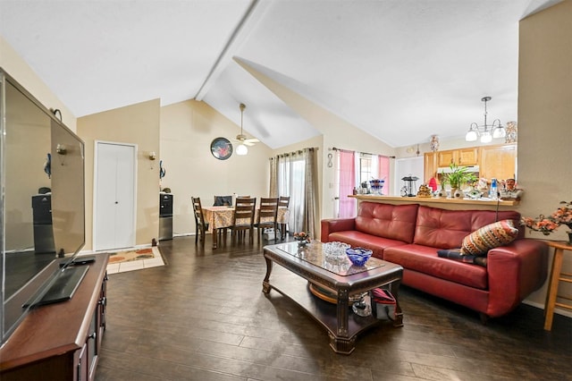 living room featuring ceiling fan with notable chandelier, dark hardwood / wood-style floors, and vaulted ceiling