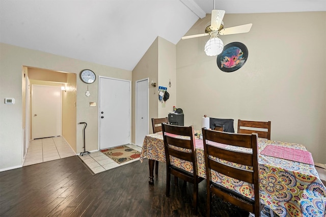 dining space with lofted ceiling with beams, light hardwood / wood-style floors, and ceiling fan