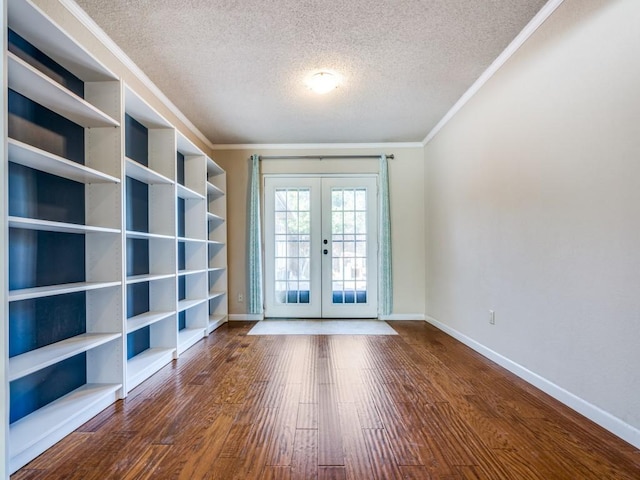 doorway to outside with french doors, a textured ceiling, hardwood / wood-style flooring, and ornamental molding