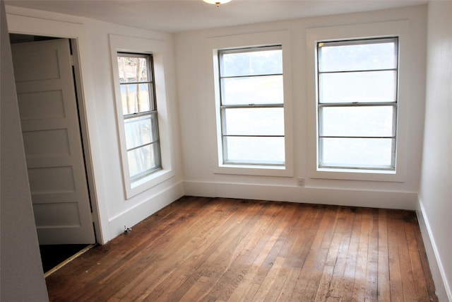 empty room featuring dark hardwood / wood-style flooring