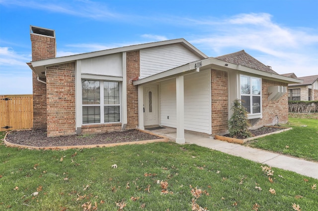 ranch-style home with a front lawn