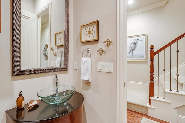 bathroom with hardwood / wood-style flooring and vanity