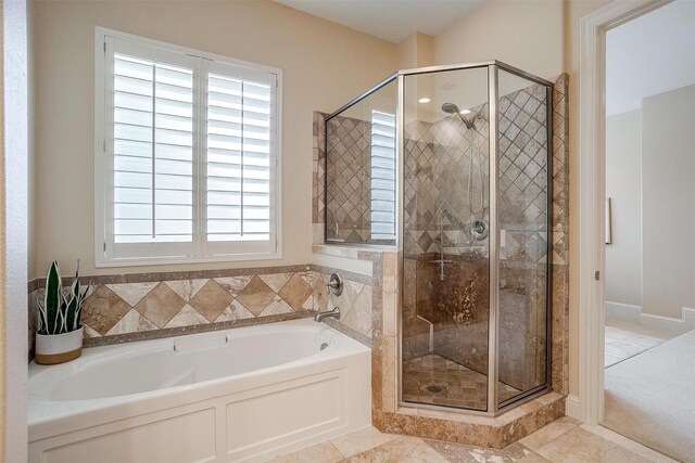 bathroom with separate shower and tub and tile patterned floors