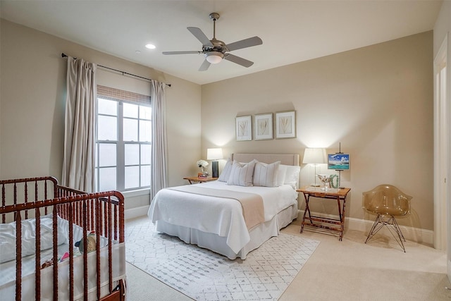 carpeted bedroom featuring ceiling fan