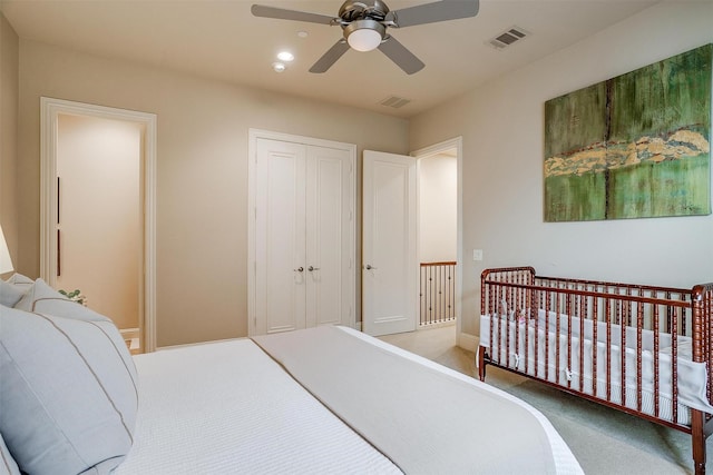 bedroom with carpet floors, a closet, and ceiling fan