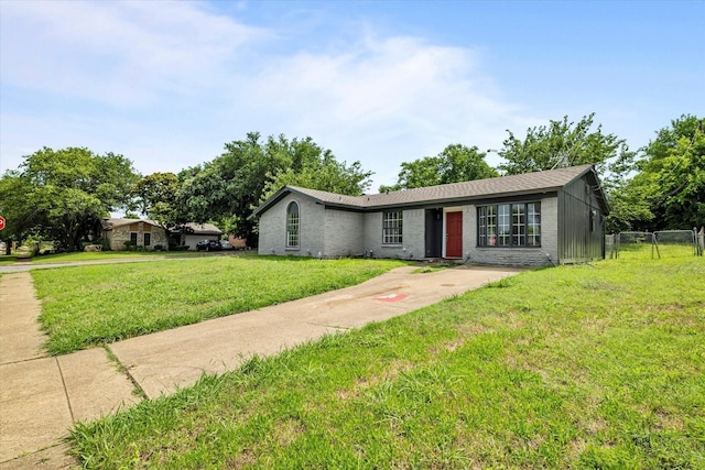 ranch-style house with a front lawn