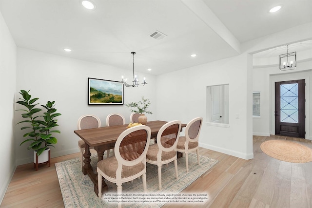 dining room with light wood-style floors, recessed lighting, visible vents, and an inviting chandelier