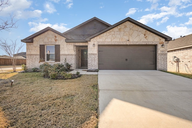 view of front of house with a front lawn and a garage